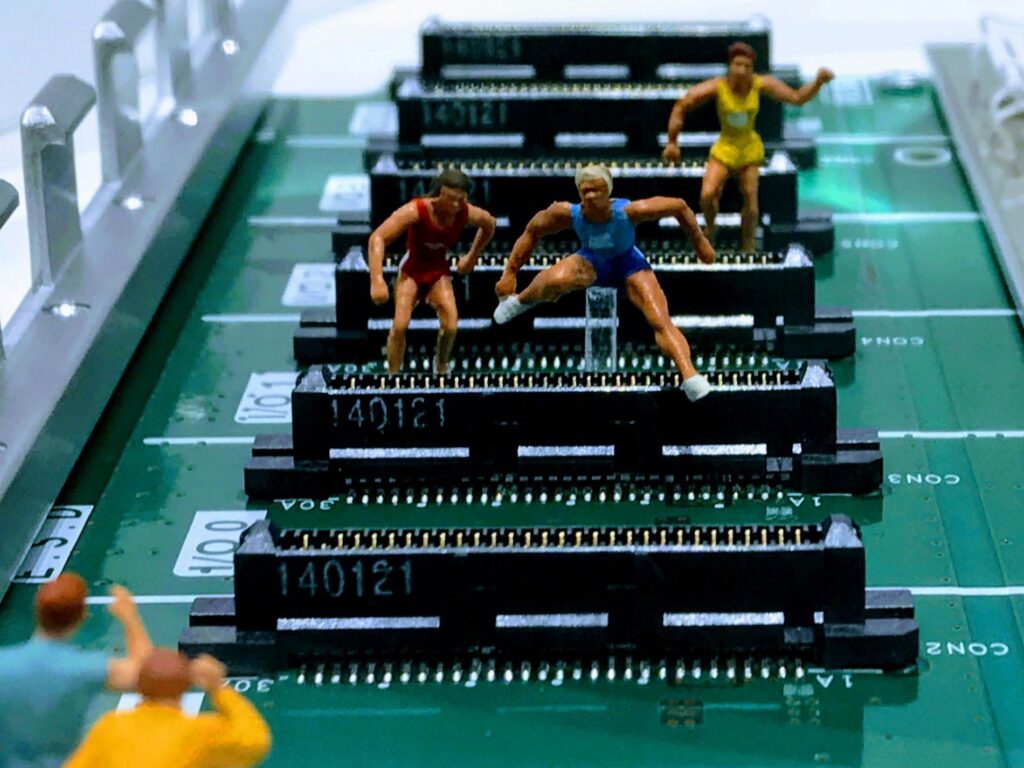 Figures hurdling on a computer board as while politicians tout AI’s promise of growth and efficiency, a new report reveals a public trust deficit in the technology.