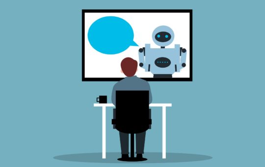 Employee chatting to a chatbot as new adoption data from Perplexity reveals how AI agents are driving workflow efficiency gains by taking over complex enterprise tasks.