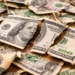 US dollar slides toward steepest weekly drop in seven months on policy uncertainty